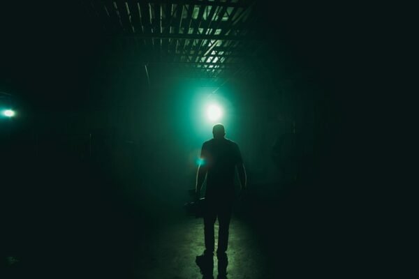 Man Standing With Blue Light